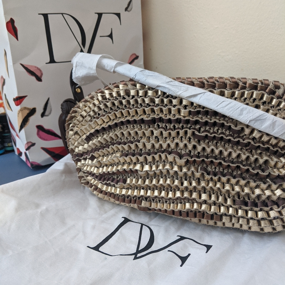 Gold Stephanie clutch by Diane von Furstenberg